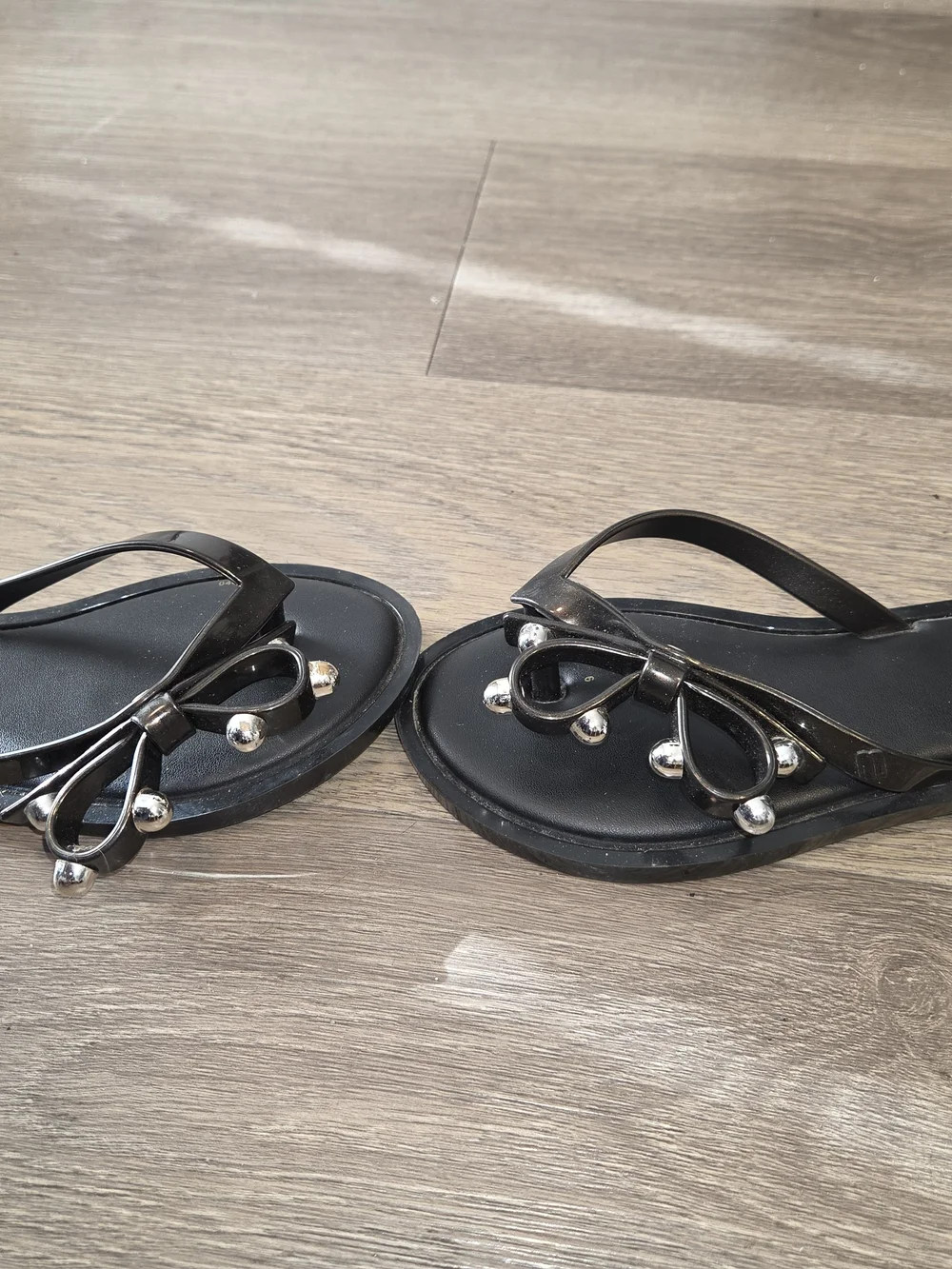 Mini Melissa Black Jelly Bow Flip Sandals with Silver Accent Ornaments